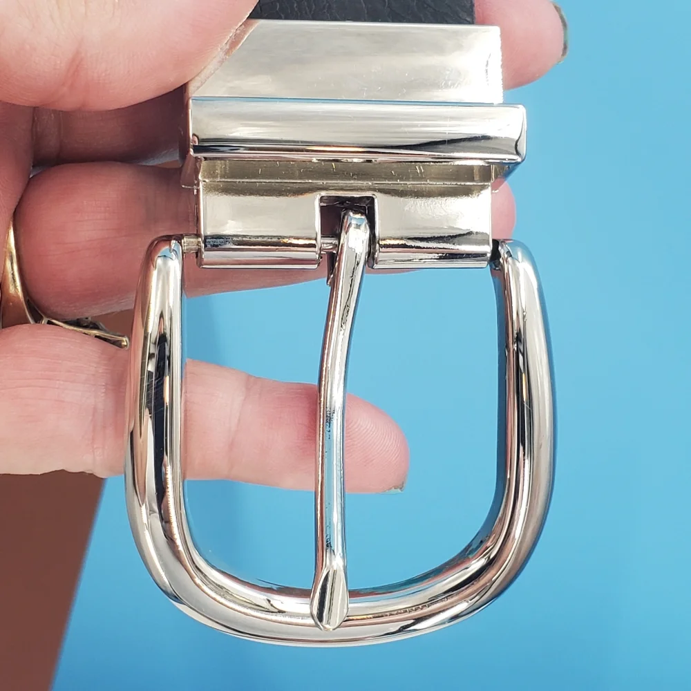 Black leather belt silver tone buckle